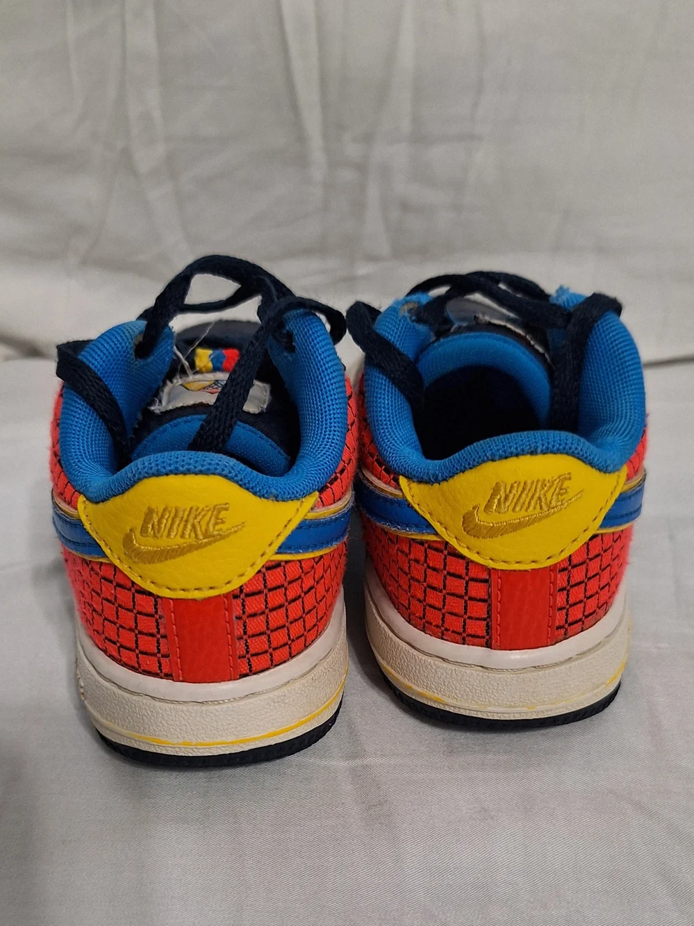 Nike Kids Navy, Blue & Red Low-Top Sneakers with Yellow Accents